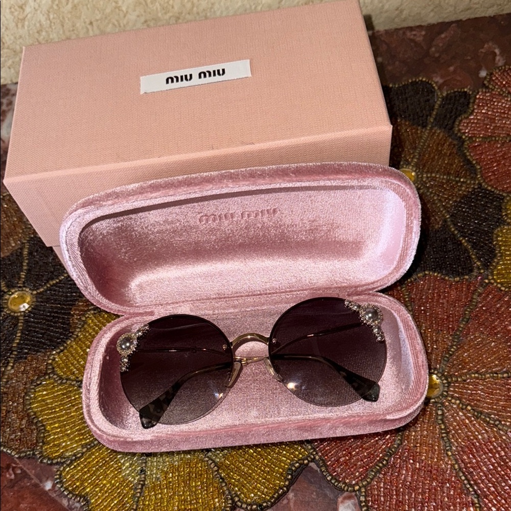 Miu Miu Sunglasses with Black Lenses